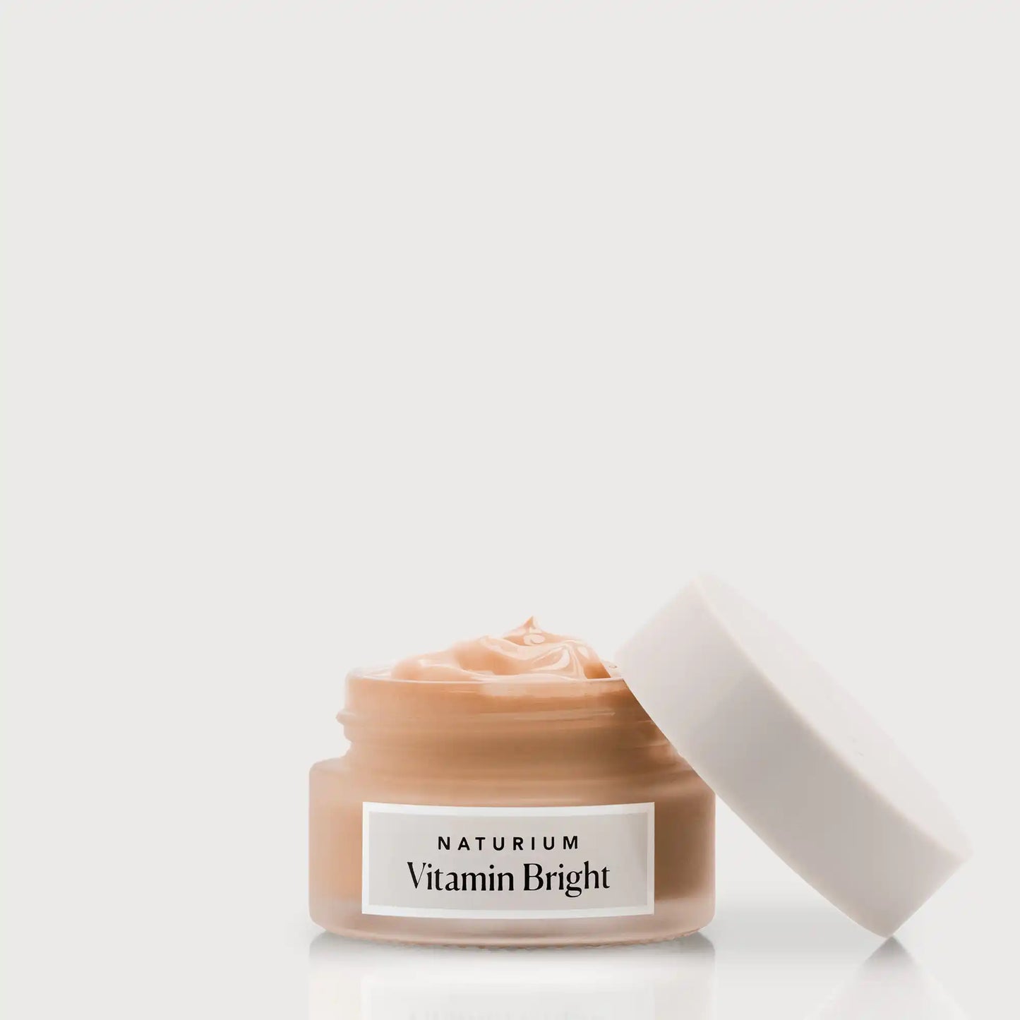 vitamin-bright-illuminating-eye-cream-a2 NATR-VitaminBright_DEEP_Primary_front_openjar_bone.webp